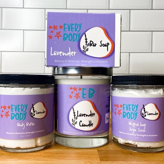 Three jar candles with bright purple labels. Made by EverBody by Dutton Farm.
