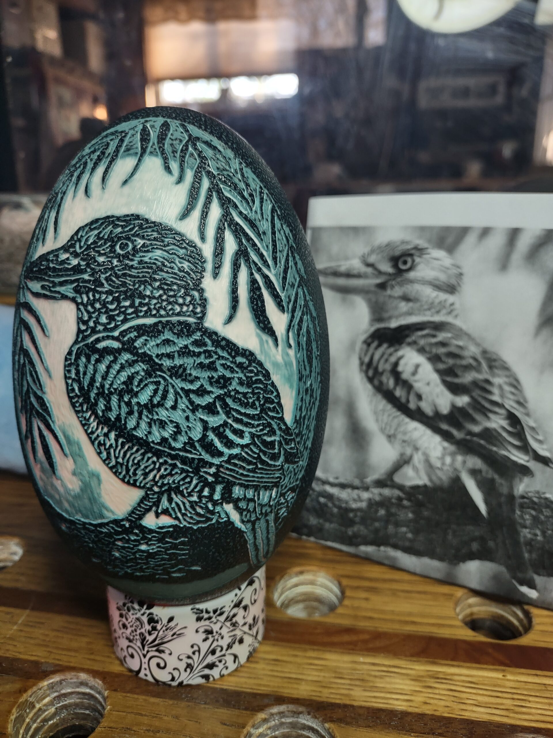 Bird carved into egg with picture of bird next to it, hand carved by Crazy Cluckers Ranch